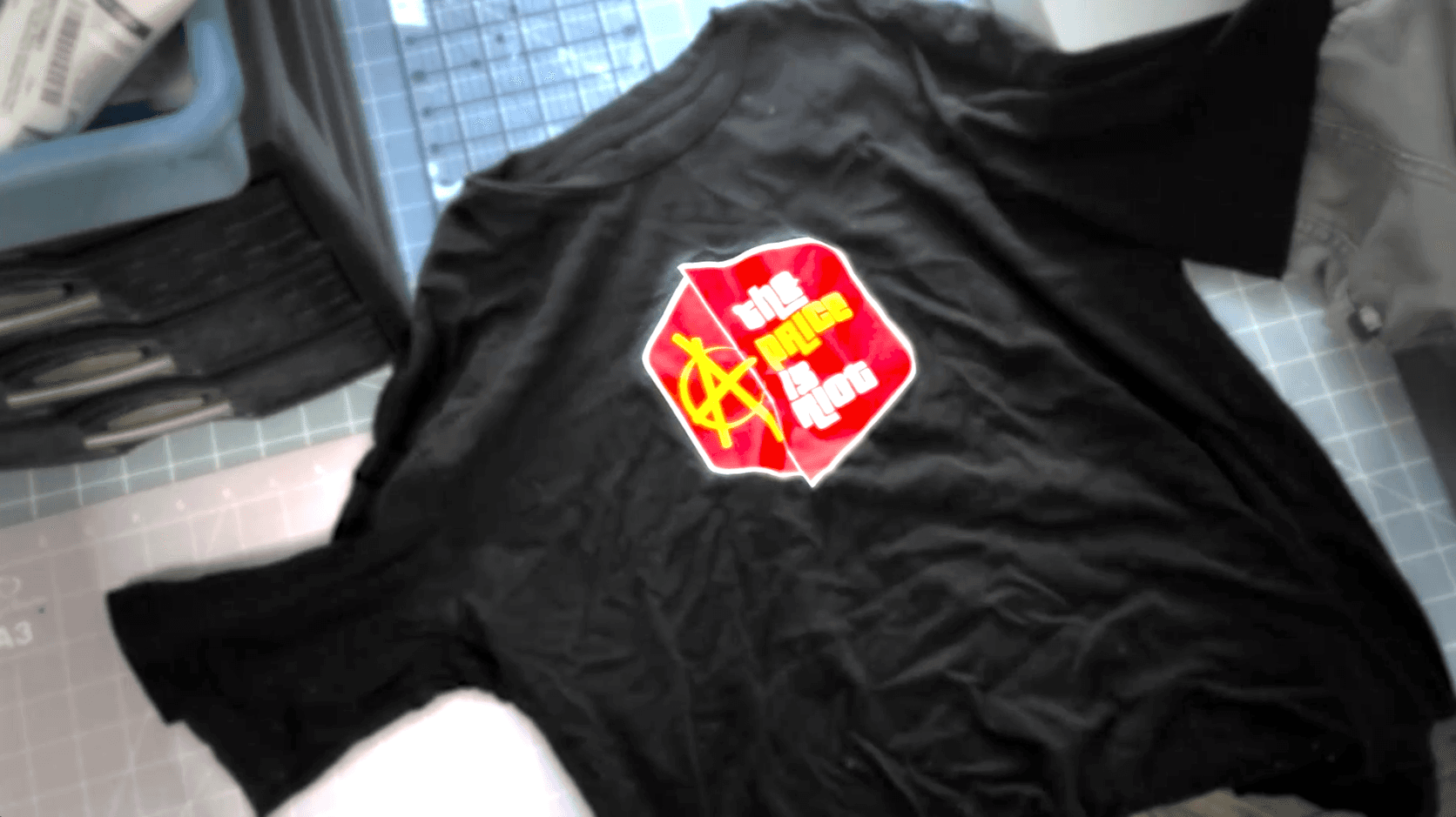 The Price Is Riot black t-shirt product shot